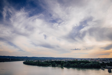 Fototapeta na wymiar View of the Danube River and the city of Novi Sad, Serbia against the background of an amazing cloudy sky during sunset