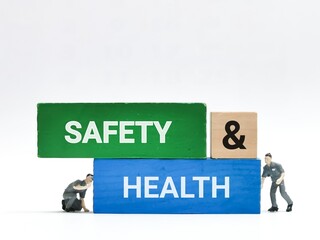 Safety at work concept. Text safety and health on wooden blocks.
