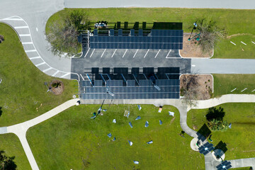 Damaged by hurricane wind photovoltaic solar panels mounted on parking lot canopy roof for...