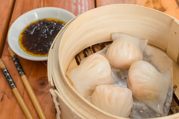Fototapeta na wymiar Flat lay of Har gow or Chinese shrimp Dumplings. Traditional Cantonese dumpling found in Guangdong province served as dim sum.