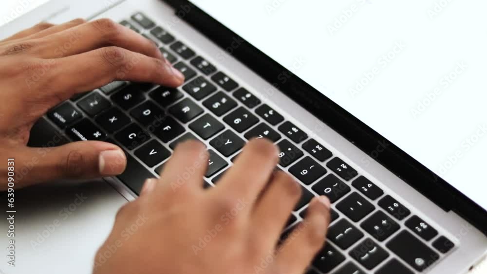 Poster close up view of a young businessman's busy hands working on a laptop or computer keyboard, sending 
