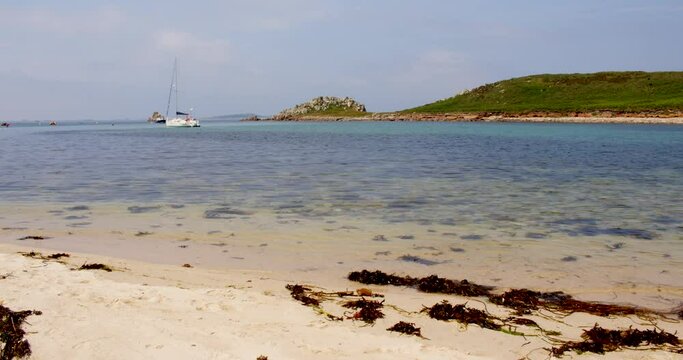 Extra wide shot of the rock formation on the island of Gugh and taken from the sandbar on St Agnes at the Isles of Scilly