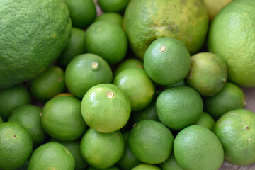 green lemons limes as a background