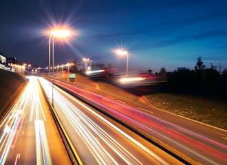 traffic on highway at night, Road with light trails of passing vehicles. Motion speed light in city. Dynamic background. Town at night with speed traffic. Generative AI. Illustration for banner.