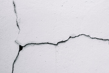 Cracks on the wall at the house or residence. The crack in the cement wall, Caused by the...