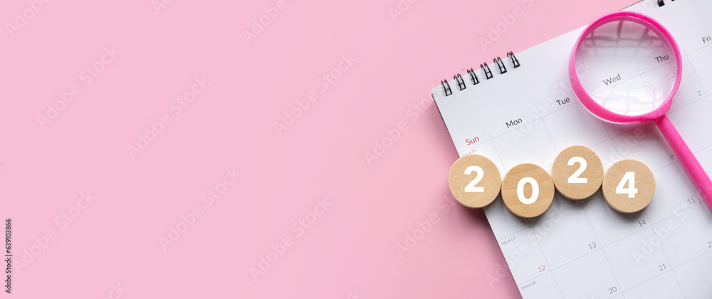 Poster new year 2024 concept. magnifying glass and calendar with a wooden circle with number over a pink ba
