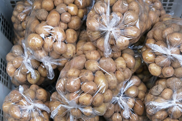 A pile of fresh organic baby potatoes, on traditional market
