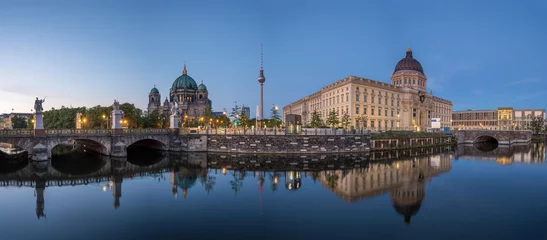 Fototapeten Panorama of the Berlin Cathedral, the famous TV Tower and the rebuilt City Palace at twilight © elxeneize