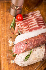 Smoked sausage with rosemary and peppercorns tomatoes and garlic