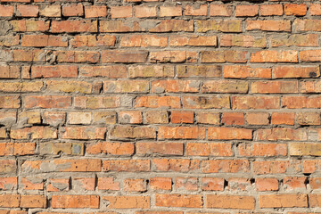 Old red brickwork. Red brick wall texture grunge background. Background of old vintage brick wall.
