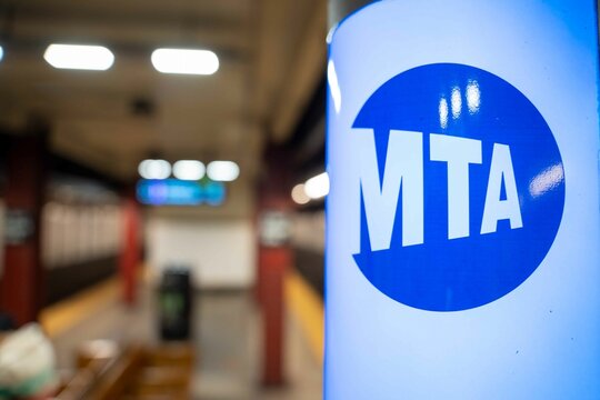 Close up on a subway Mass Transit Authority (MTA) sign in a New York subway station.