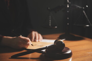 Business and lawyers discussing contract papers with brass scale on desk in office. Law, legal...