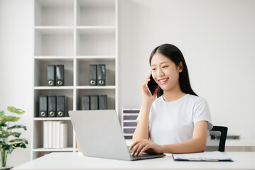 Business woman using tablet and laptop for doing math finance on an office desk, tax, report, accounting, statistics, and analytical research concept in office