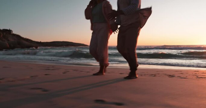 Closeup, holding hands and sunset with couple at beach for travel, summer vacation and romance. Relax, support and holiday with man and woman walking on seaside date for commitment and care together