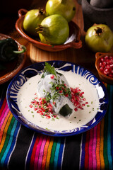 Chile en Nogada, Typical dish from Mexico. Prepared with poblano chili stuffed with meat and fruits and covered with a walnut sauce. Named as the quintessential Mexican dish for national holidays.