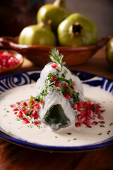 Chile en Nogada, Typical dish from Mexico. Prepared with poblano chili stuffed with meat and fruits and covered with a walnut sauce. Named as the quintessential Mexican dish for national holidays.