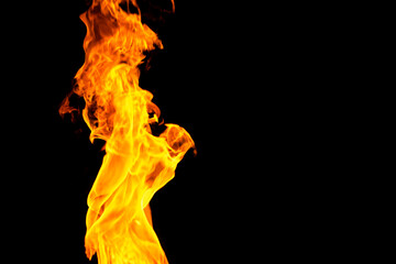 Close up of yellow flames and copy space on black background