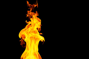 Close up of yellow flames and copy space on black background