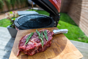 Barbecue Tomahawk Steak ready to be grilled outdoors
