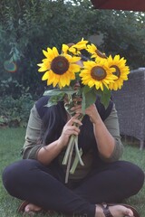 child with sunflower