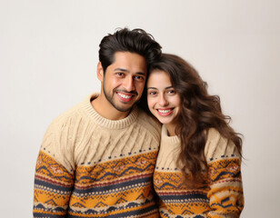 Happy Indian couple in winter wear or sweater