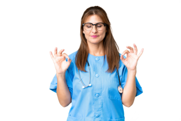 Middle age nurse woman over isolated background in zen pose