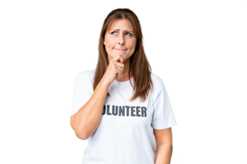 Middle age volunteer woman over isolated background having doubts and thinking