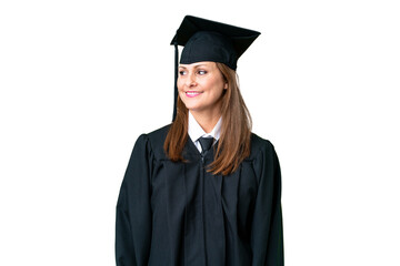 Middle age university graduate woman over isolated background looking side