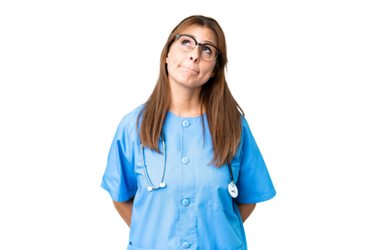 Middle age nurse woman over isolated background and looking up