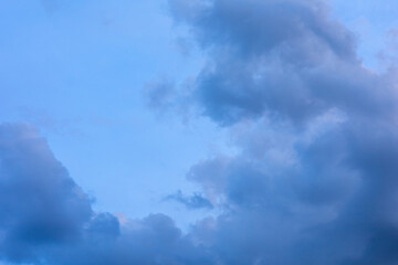 Dark blue sky with white clouds background blue cloud texture Dark blue sky wallpaper with full white clouds and sunlight.