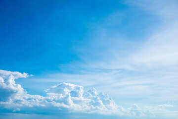 Dark blue sky with white clouds background blue cloud texture Dark blue sky wallpaper with full white clouds and sunlight.