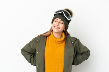 Skier caucasian woman with snowboarding glasses isolated on white background posing with arms at hip and smiling