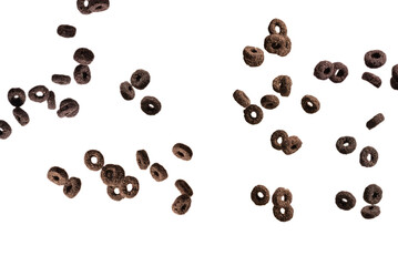 Chocolate rings cereal spill out into a bowl. Breakfast.