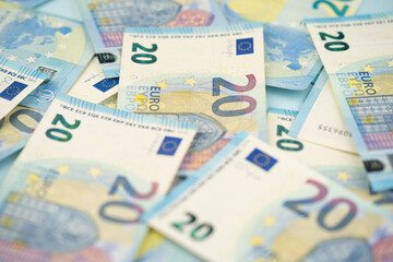 many 20 euro bills close-up mixed randomly