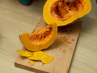 sliced pumpkin on a board