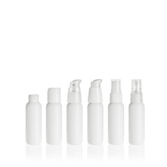 Group of white cosmetic transparent bottles isolated on white background with disc top cap, lotion pump and spray pump. Packaging of bottles for cosmetics and medical products.