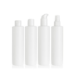 Group of white cosmetic transparent bottles isolated on white background with disc top cap, flip cap, lotion pump and spray pump. Packaging of bottles for cosmetics and medical products.