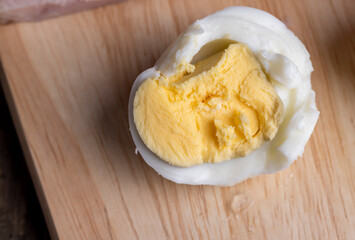 Boiled chicken egg with sliced pieces of meat