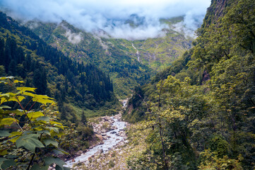 River in the Mountains.  With a stunning backdrop of the mighty Himalayan ranges, scenic Valley of Flowers National Park, and a UNESCO World Heritage site. District; Chamoli, Uttarakhand, India.