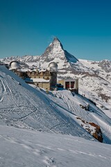 ski resort in the mountains, observatory in the foreground, Matterhorn in the background
