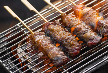 wagyu Meat skewer being grilled