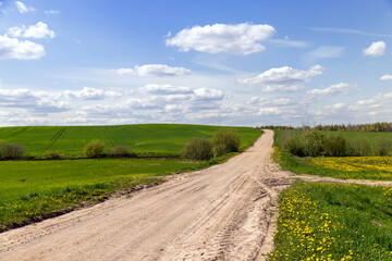 unpaved road in rural areas in spring, unpaved road