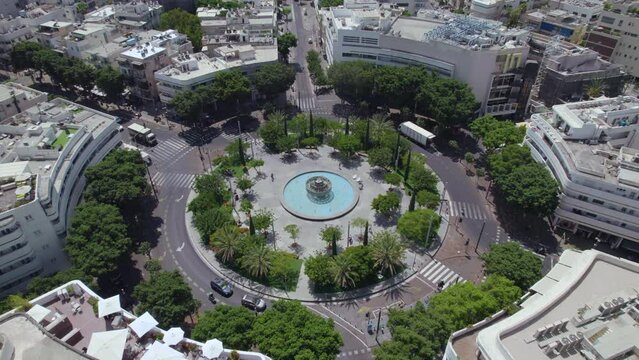 Circling around Dizengoff Square, Tel Aviv at noon on a very hot summer day without many people and activity, people prefer to be in an air conditioned environment