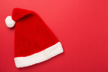 Santa Claus red hat on color background, top, view