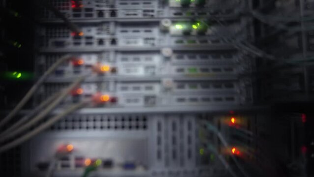 Blurred blinking colorful lights server rack Blurred server telecommunications equipment.