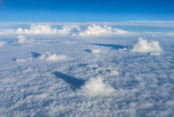 Fototapeta premium White clouds in the troposphere. Scenery Seen from an airplane in flight.
