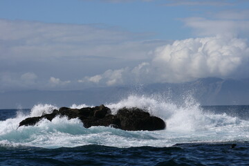 waves crashing on a rock