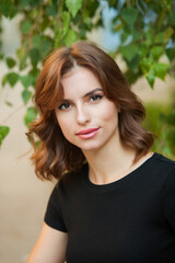 Close up portrait of a beautiful young woman smiling and looking at camera. White European girl with beautiful smile