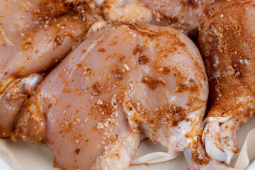 chicken legs marinated in spices close-up