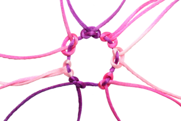 PNG,multi-colored braided cords diverge to the sides from a large knot in the center. The concept of creative cooperation and exchange., isolated on white background